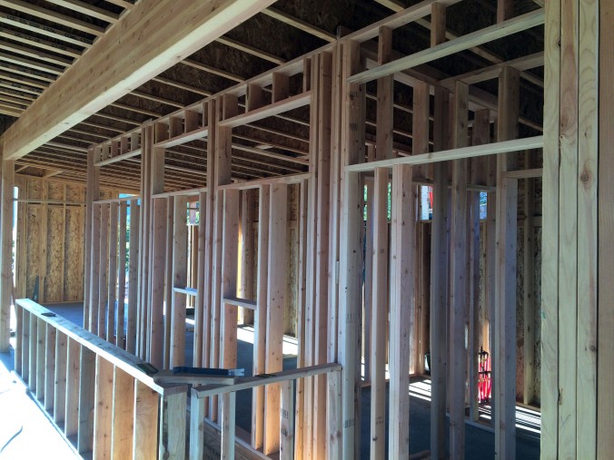 Upstairs wall framing. 4 interior windows up high that let light flow from the great room to the private areas of the home.